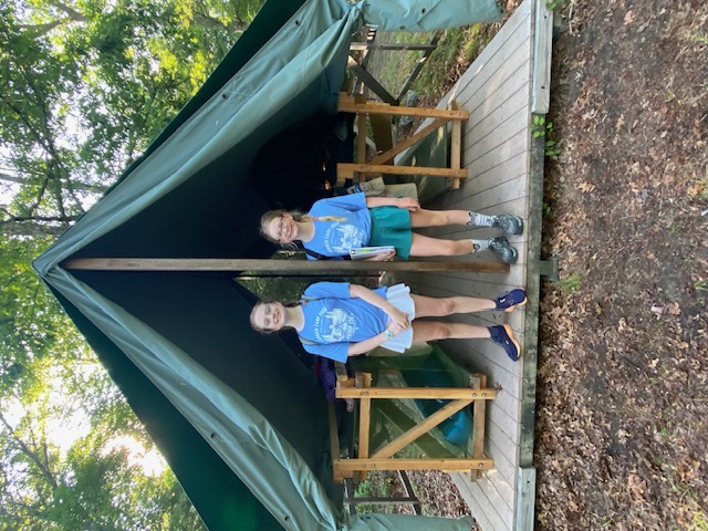 In front of tent